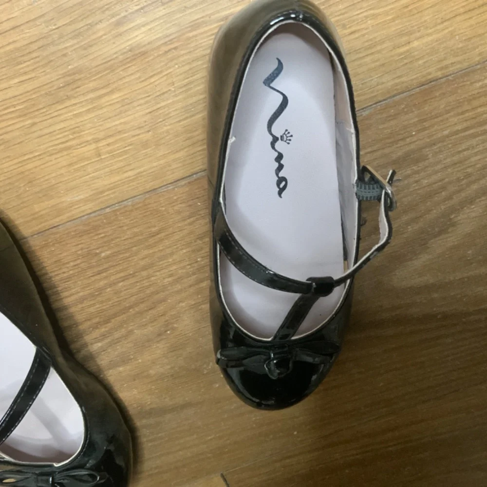 Nina “Jami” Black Patent Shoes